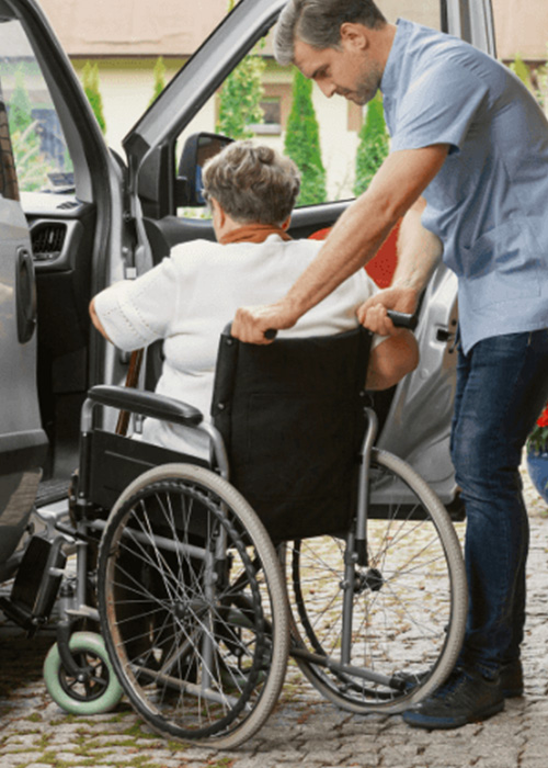 Lady being pushed in wheelchair